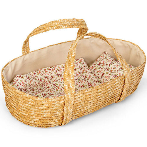mini mommy poppenreiswieg van stro met gebloemd dekbed en kussen.