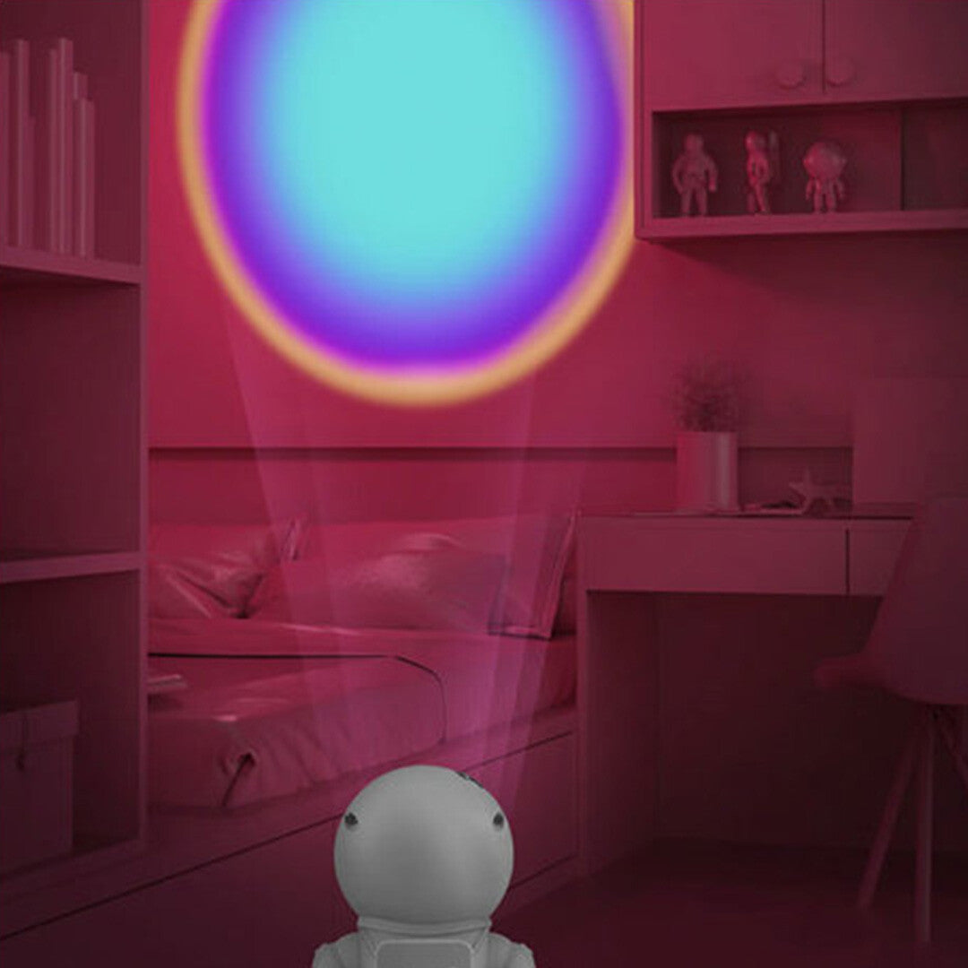 mob astronaut nachtlampje projecteert een grote regenboogcirkel op de muur in een slaapkamer.