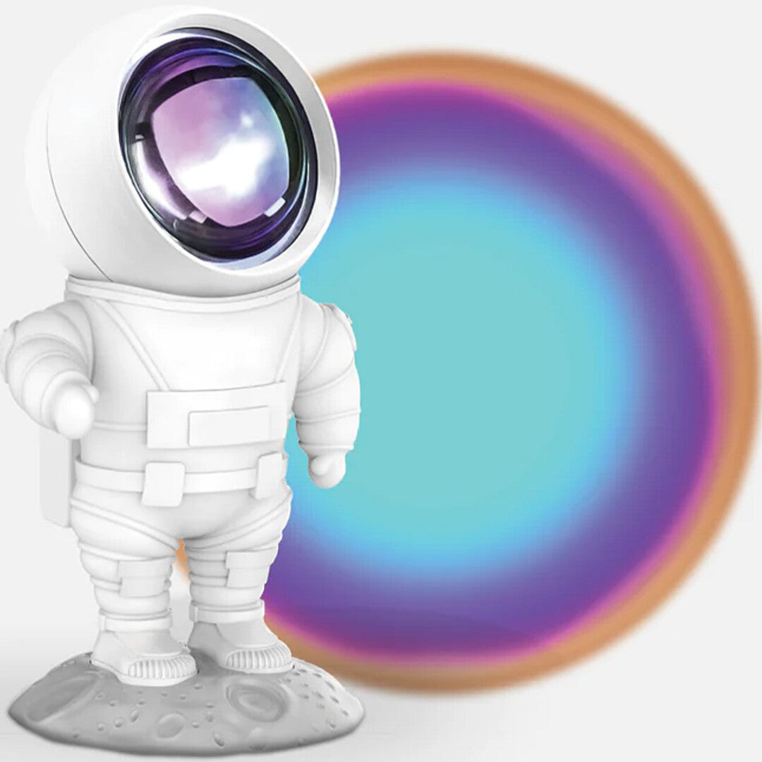 mob astronaut nachtlampje met een regenboogprojectie op de achtergrond.