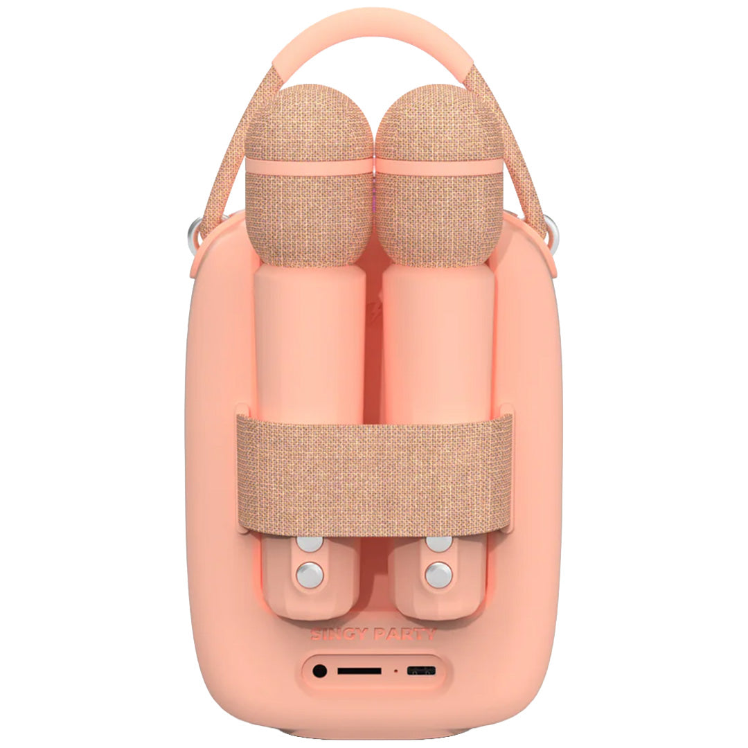 Achteraanzicht van de mob roze karaokeset speaker met twee opgeborgen microfoons.