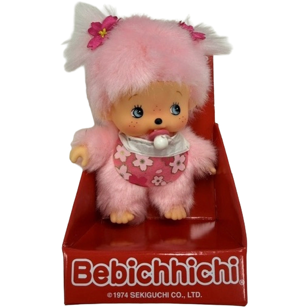 Monchhichi Bebichhichi pluchen pop in de rode verpakking.