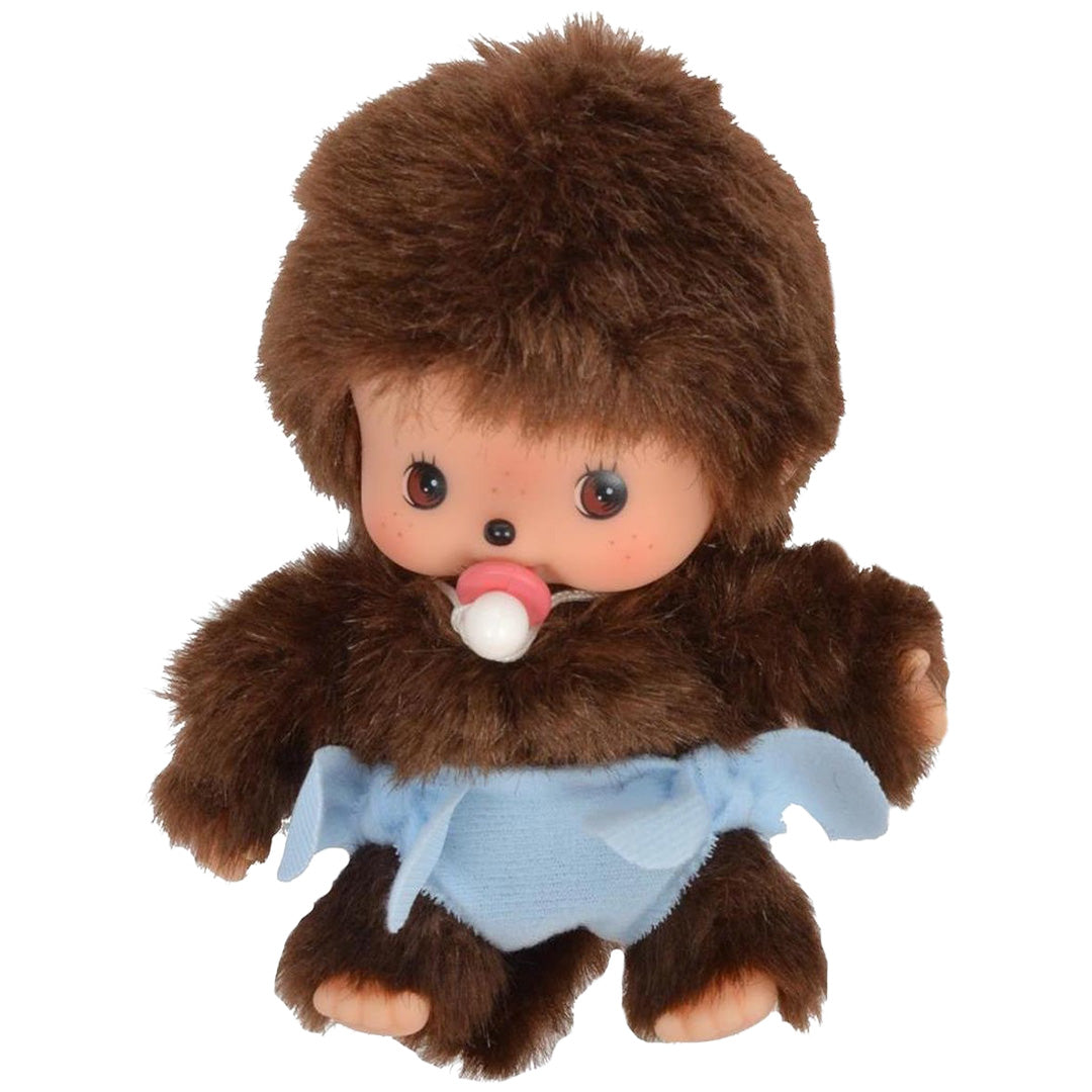Monchhichi pluchen pop met bruine vacht, blauwe luier en speen.