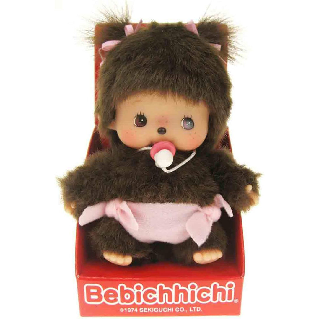 Monchhichi pluchen popje van een meisje in de rode Bebichhichi verpakking.