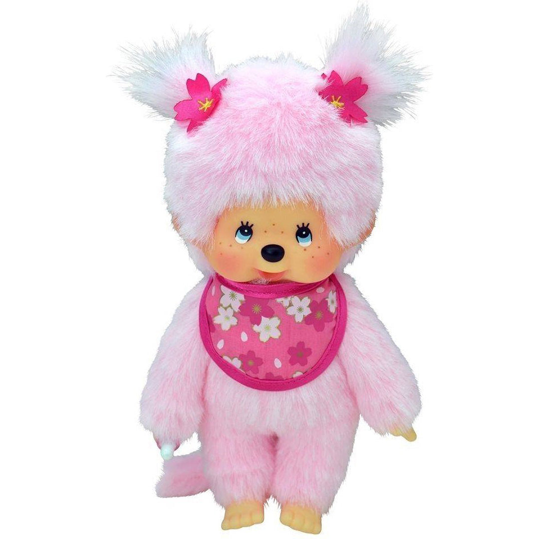 Monchhichi pluchen pop meisje met roze bloemen en een gebloemd slabbetje.