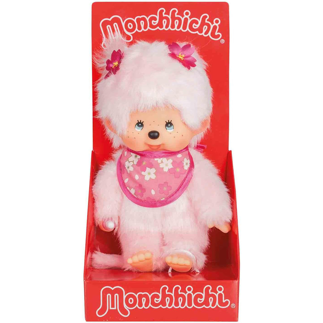 Monchhichi pluchen pop meisje in de rode productverpakking.