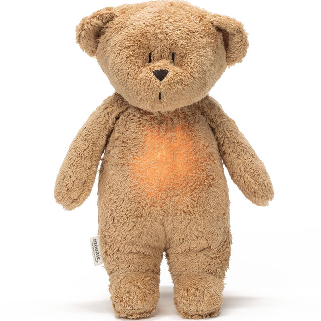 moonie pluchen knuffelbeer met nachtlamp en geluid, met een oranje gloed op de buik.