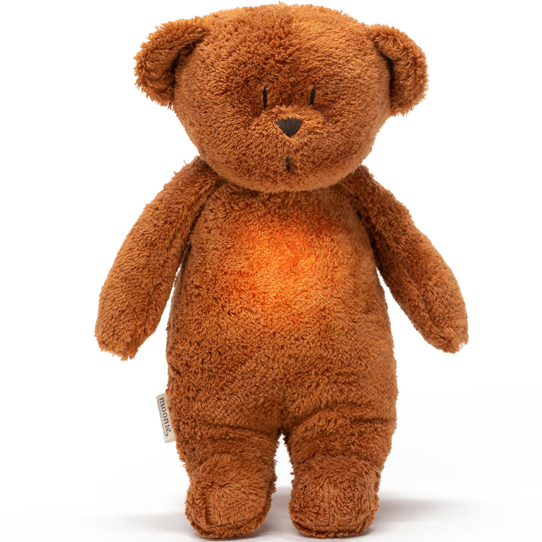 Moonie knuffelbeer met nachtlamp, een bruine teddybeer met een oranje gloed op de buik.