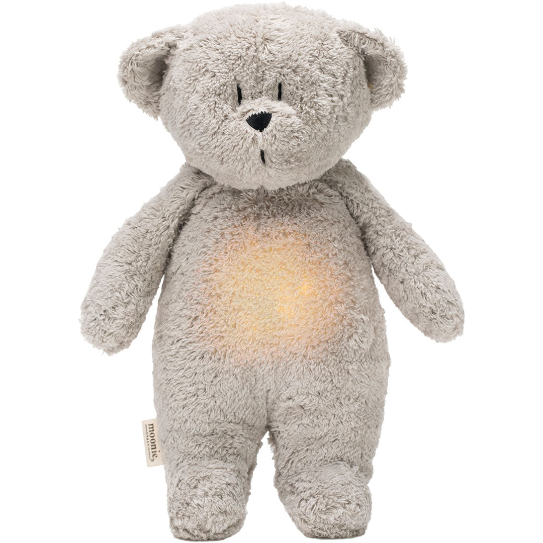 Moonie grijze pluchen knuffelbeer met een oplichtende buik als nachtlamp.