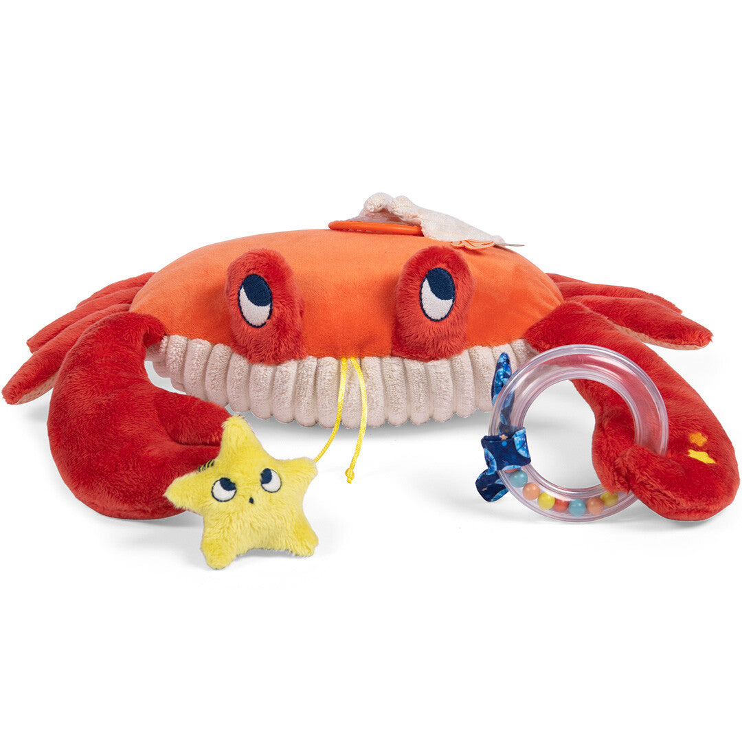 Schuin zijaanzicht van de Moulin Roty activiteitsspeelgoed krab met een gele ster en een rammelaar.