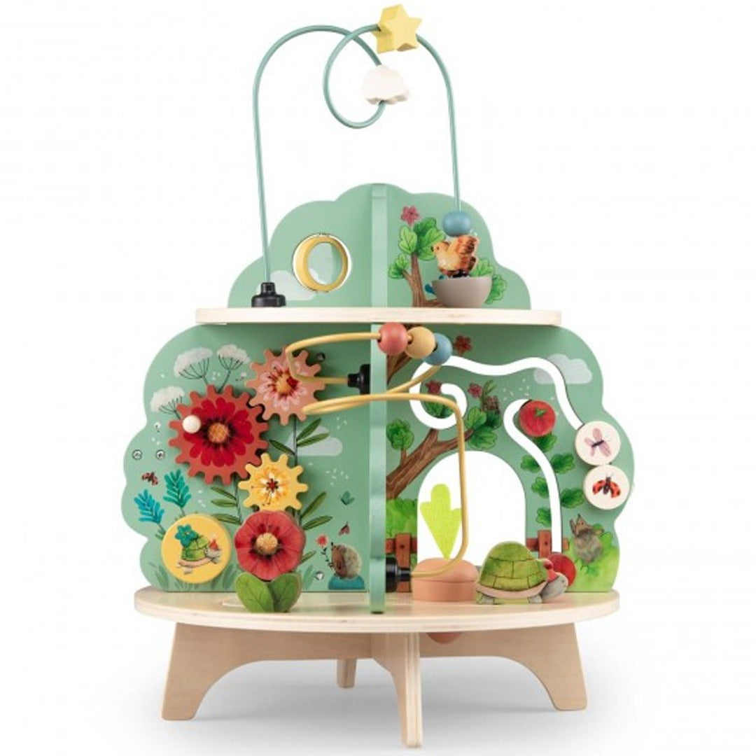 Moulin Roty activiteitentafel met draaiende tandwielen en bloemmotieven.