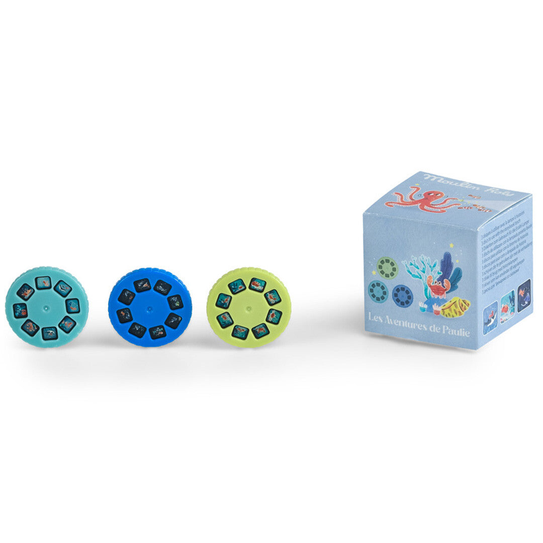 Drie Moulin Roty projector discs met onderwaterdieren en een lichtblauwe verpakking van Les Aventures de Paulie.