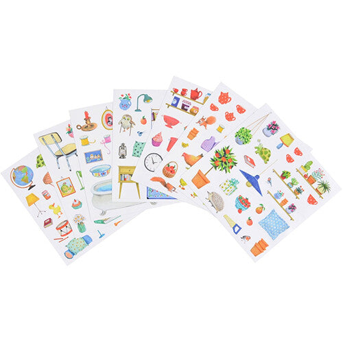 Meerdere vellen met kleurrijke stickers van huisraad en kleine dieren.