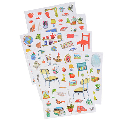 Meerdere vellen met kleurrijke stickers van meubels en diverse voorwerpen.