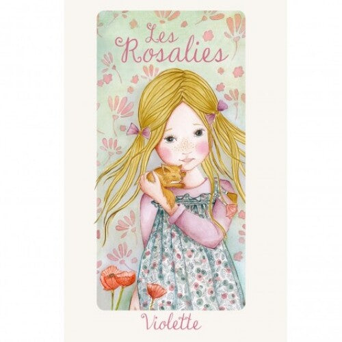 Verpakking van de Violette lappenpop met een illustratie van een meisje en bloemen.