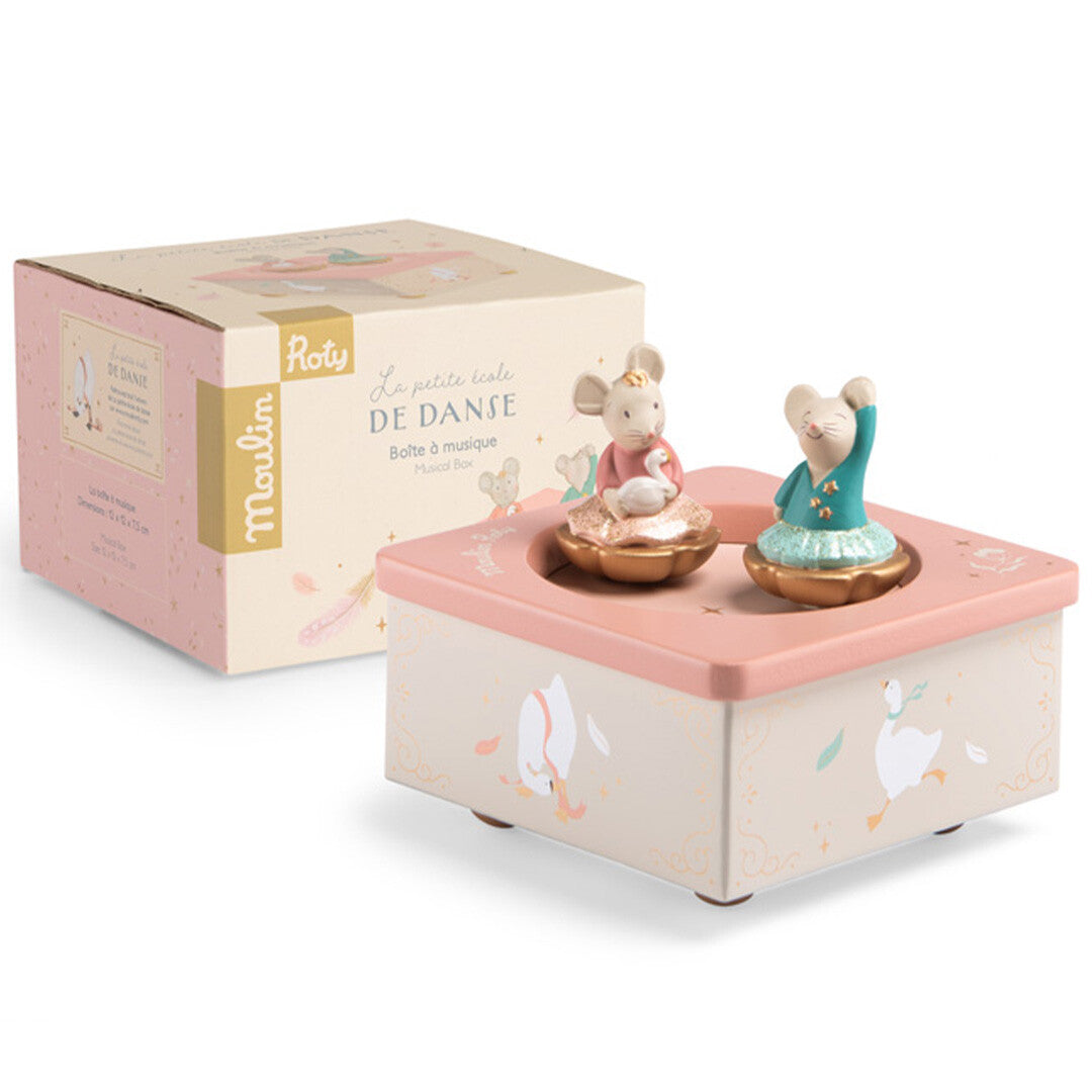 Moulin Roty muziekdoosje voor baby's met de roze productverpakking ernaast.