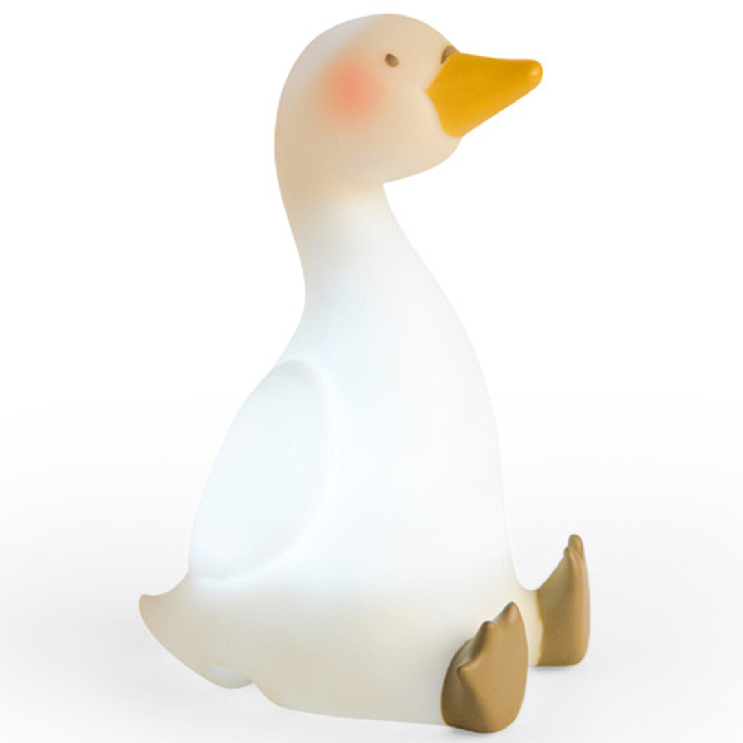 Moulin Roty nachtlampje in de vorm van een zittende beige zwaan, lichtgevend.