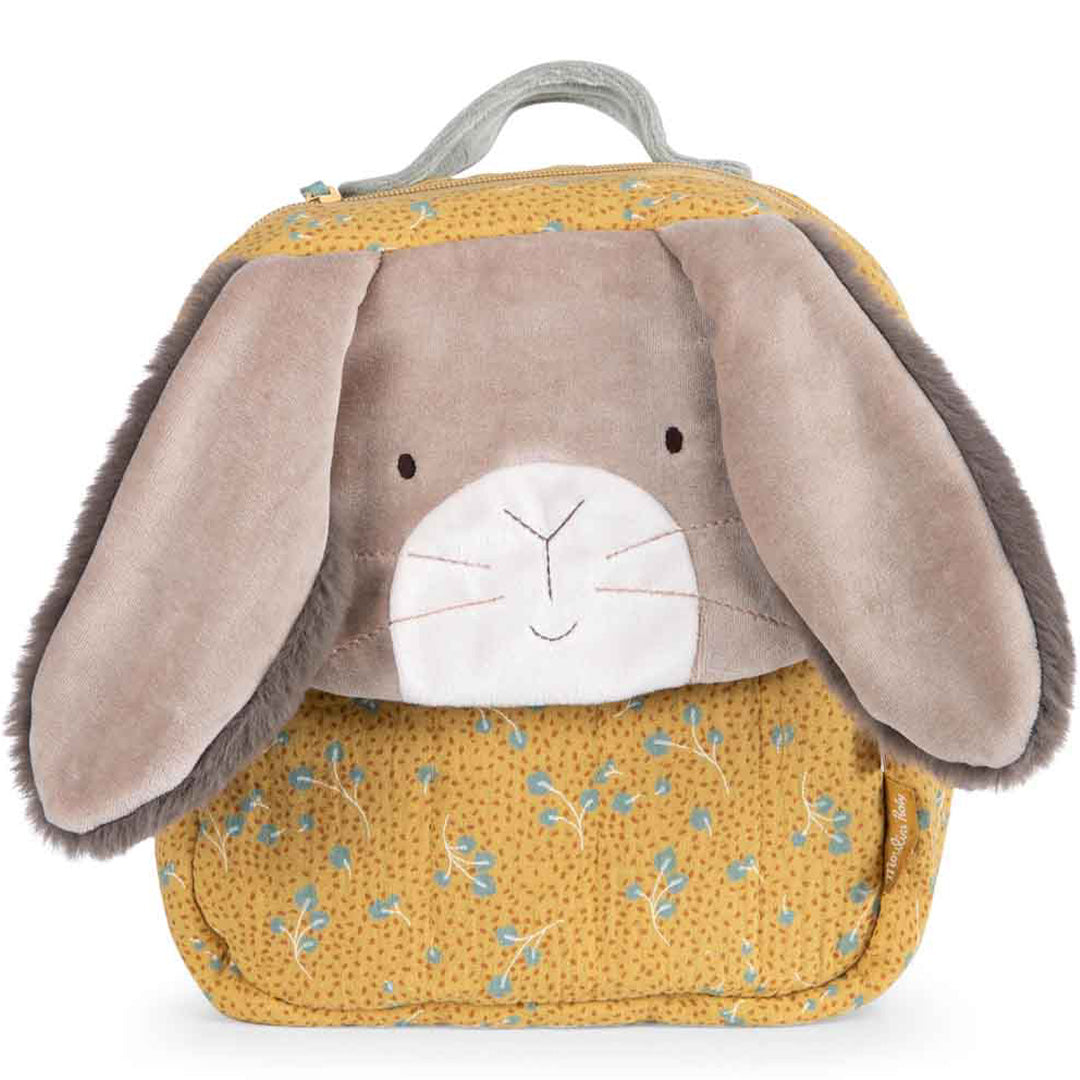 Moulin Roty peuterrugzak met konijnengezicht en okergele stof met bladerenpatroon.