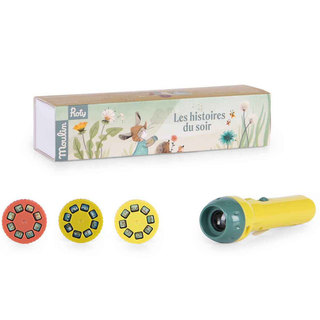 Moulin Roty projector voor bedtijdverhalen met een gele zaklamp, drie schijven en de verpakking met konijnenillustratie.