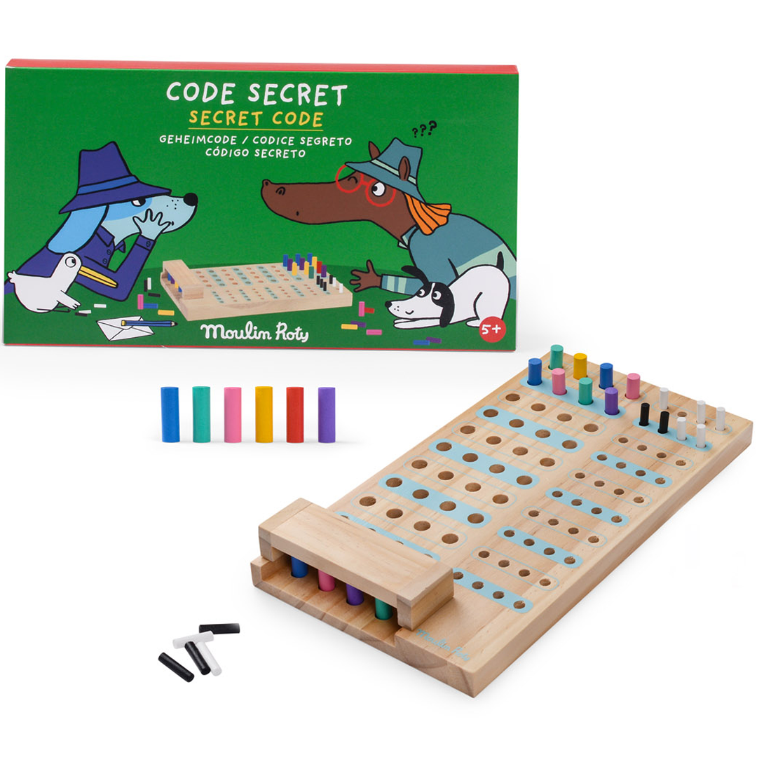 Moulin Roty houten raadspel met de groene verpakking met cartoonhonden en losse gekleurde pionnen.