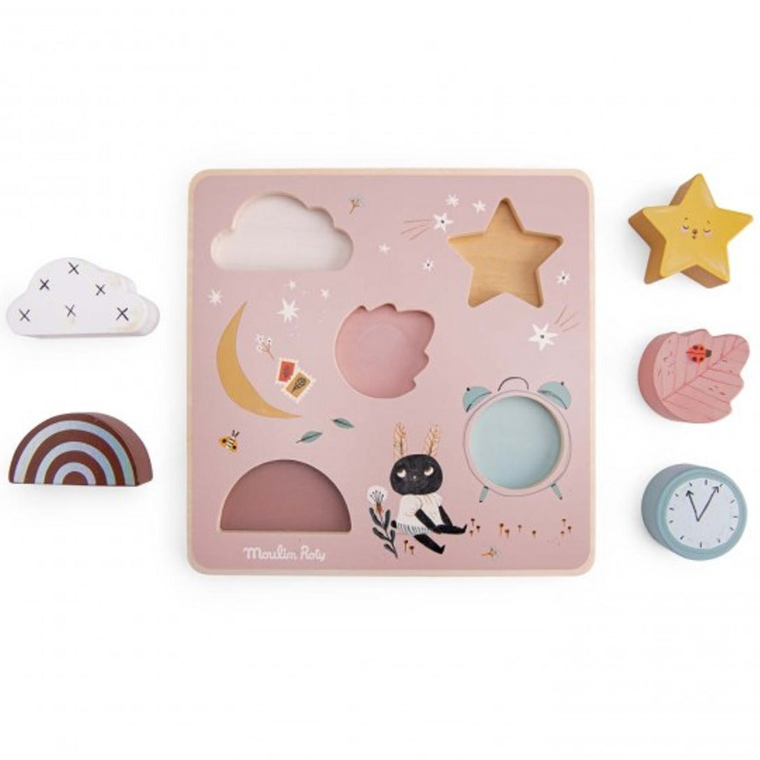Moulin Roty houten sensorische puzzel met de roze achtergrond en de vijf losse puzzelstukken ernaast.