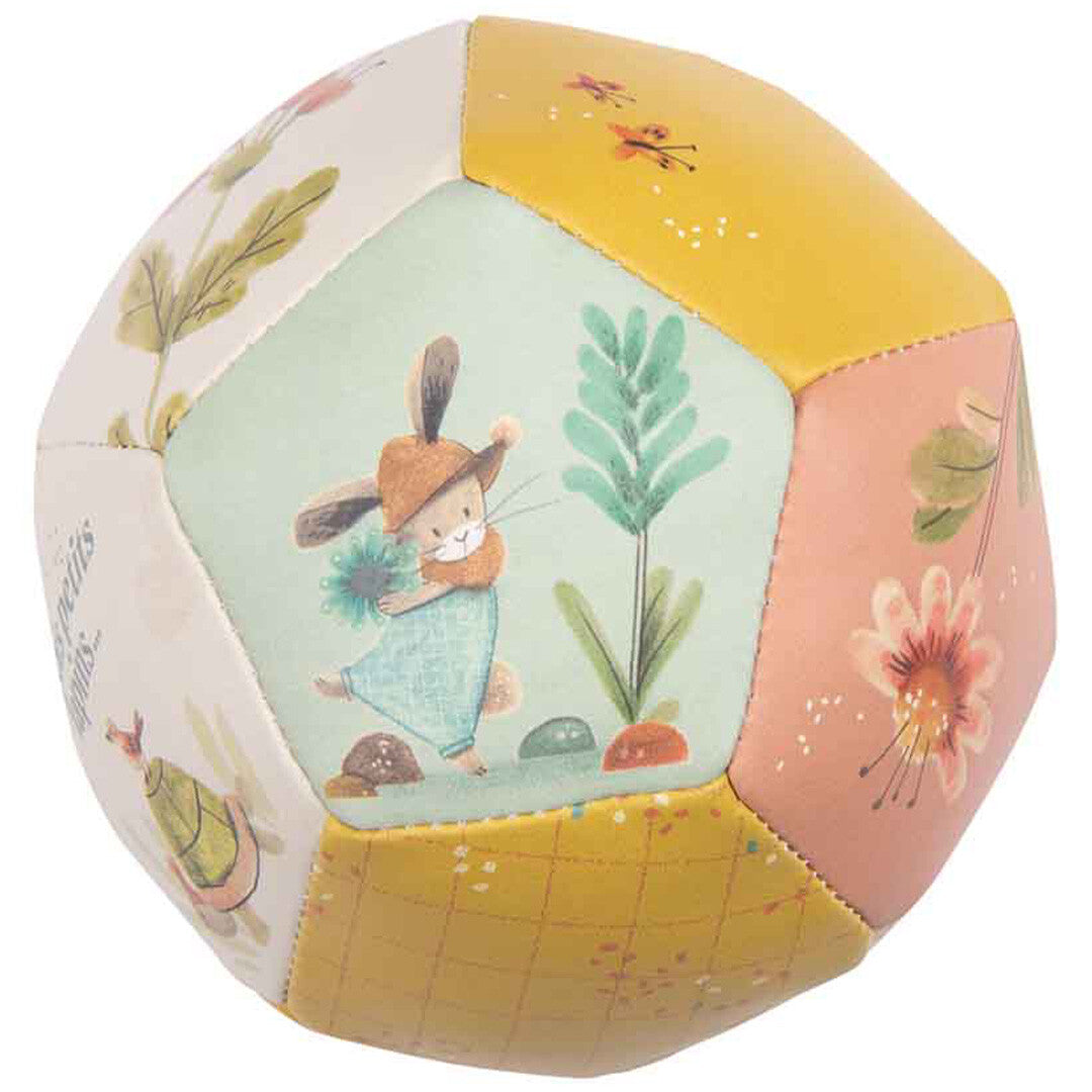 Veelkleurige babyspeelbal met een paneel waarop een konijn met een bloem staat afgebeeld.