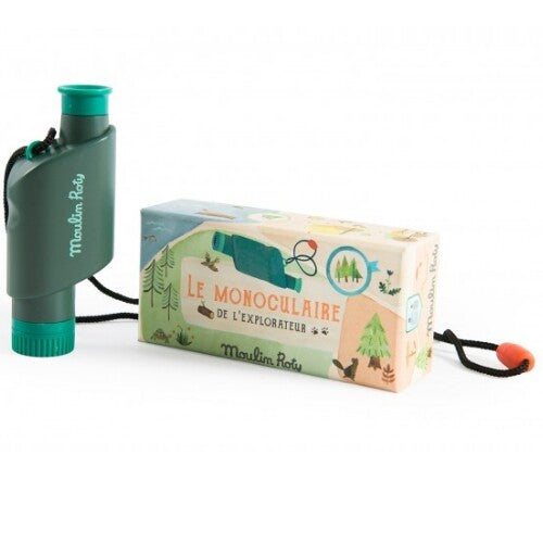 Moulin Roty groene plastic monoculair voor ontdekkingsreizigers, naast de verpakking met een natuurthema.