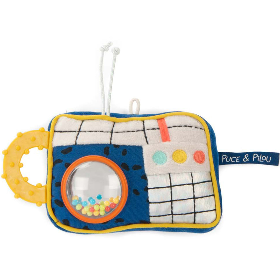 Een kleurrijke Moulin Roty babyspeelgoed camera met een gele bijtring en een venster met rammelkralen.