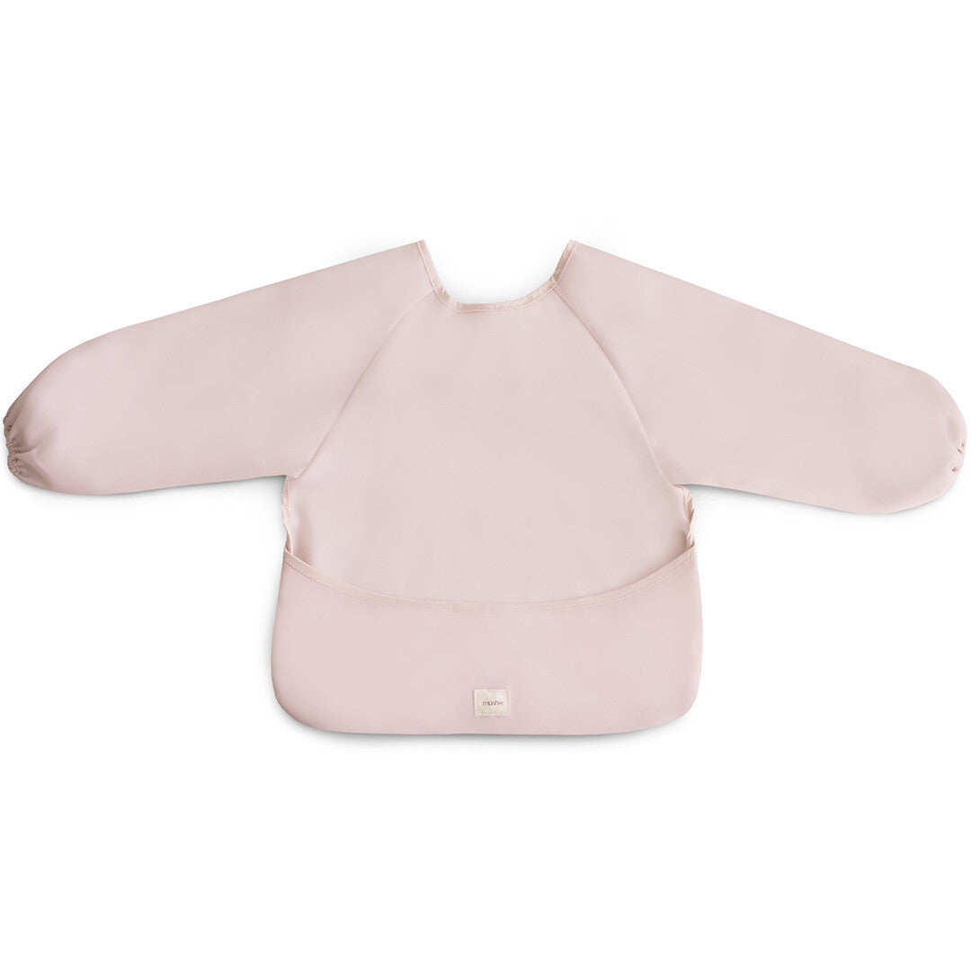 Mushie mouwslab in blush roze met lange mouwen en opvangzakje.
