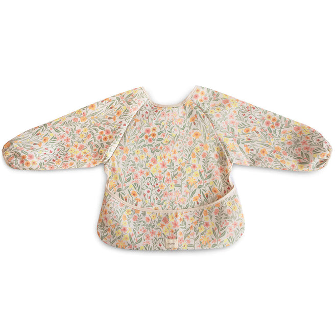 Mushie mouwslab voor baby's met een pastel bloemenpatroon, plat op een witte achtergrond.