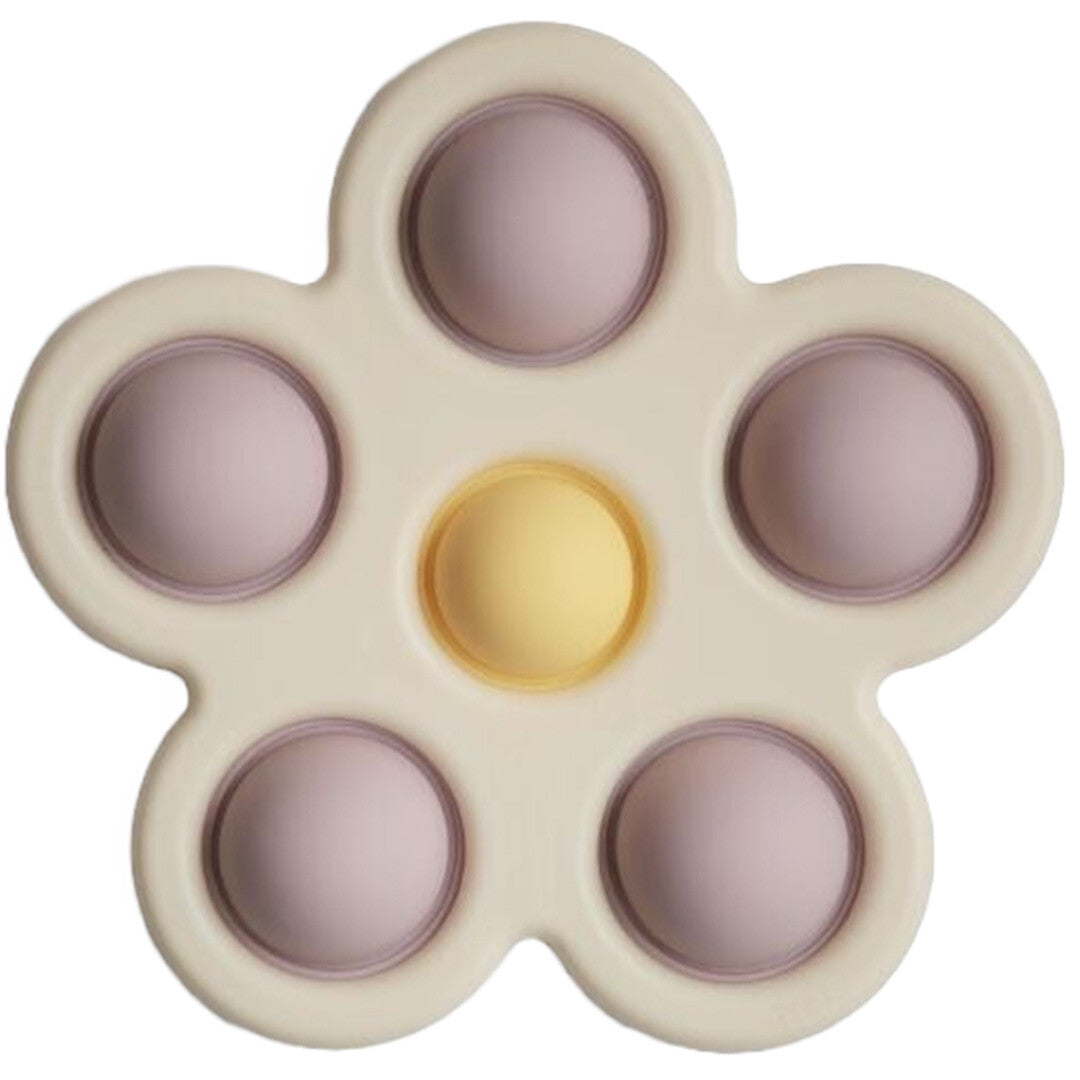Een mushie sensorische bloem in beige met lila en gele bubbels.