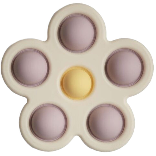 Een mushie sensorische bloem in beige met lila en gele bubbels.