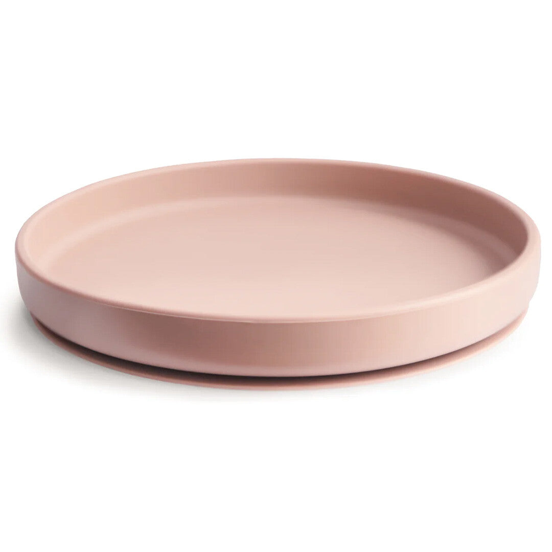 Mushie siliconen babybord met zuignap in roze kleur.