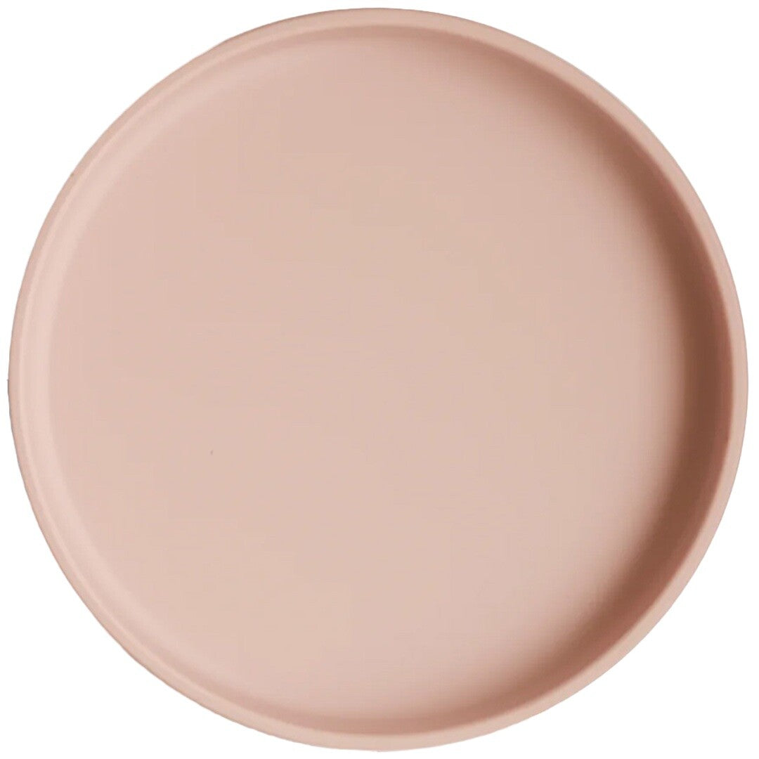 Rond roze siliconen babybord met zuignap, van bovenaf gezien.