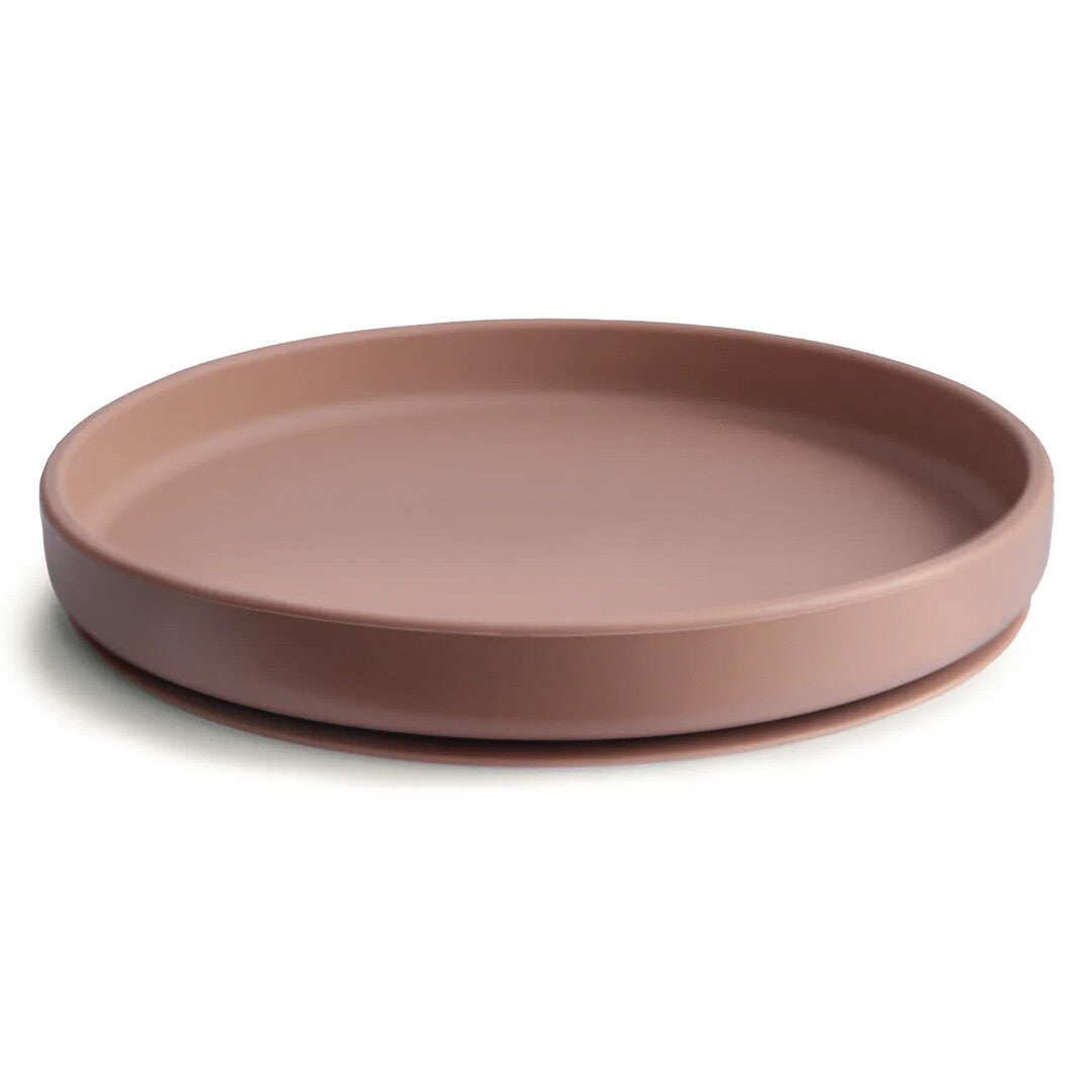 Mushie siliconen babybord met zuignap in cloudy mauve, schuin gefotografeerd.