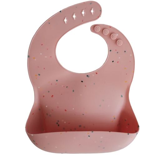 Mushie roze siliconen slabbetje met confetti-patroon en opvangbakje.
