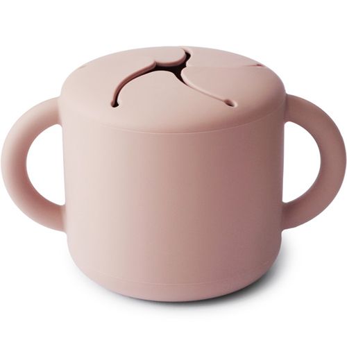 Een roze mushie siliconen snackbeker voor baby's en peuters.