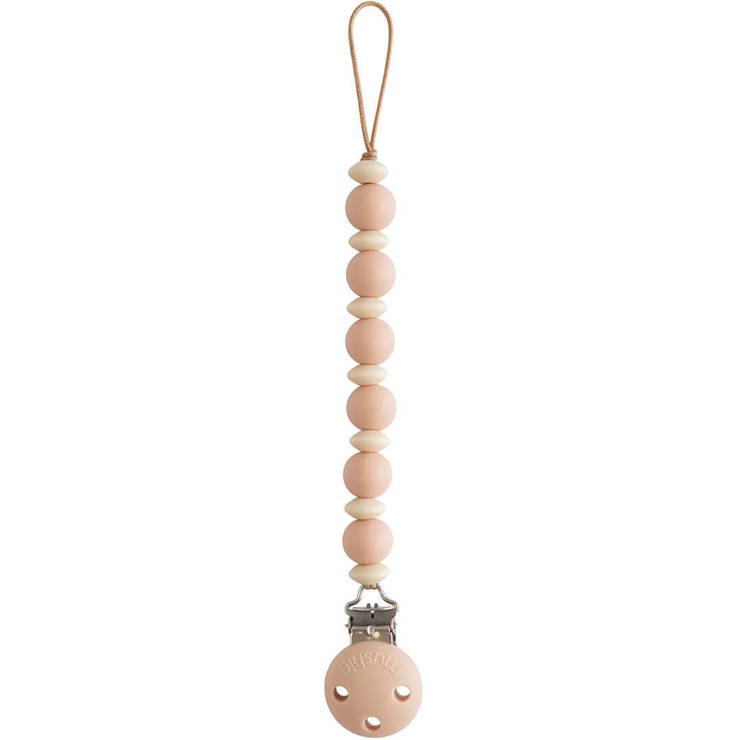 Mushie speenkoord met roze en crèmekleurige kralen en een roze clip.