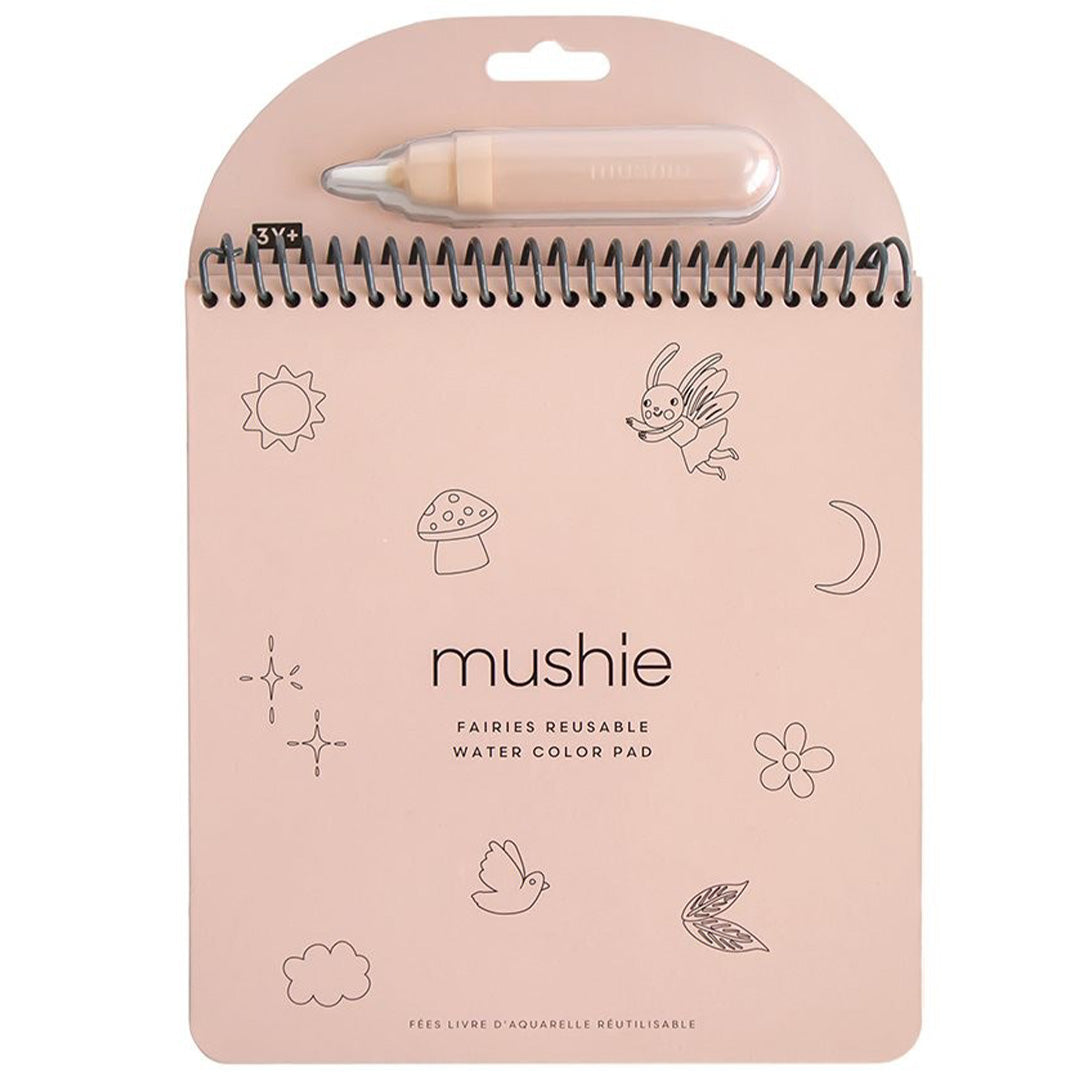 Mushie herbruikbaar waterkleurboek met spiraalbinding en waterpen, met illustraties van feeën en natuur.