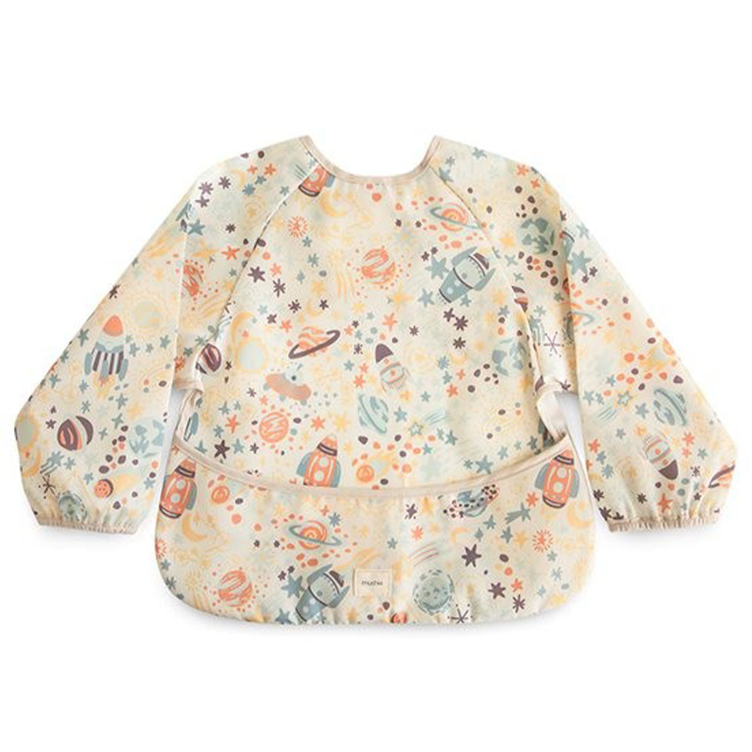Mushie mouwslab voor baby's met een beige ruimtevaartpatroon van planeten en raketten.