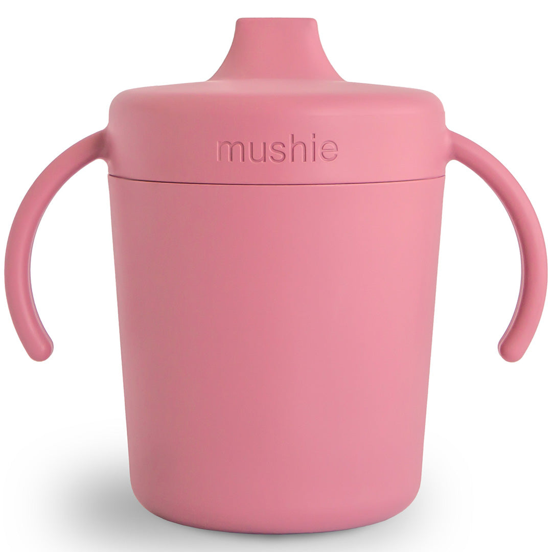 Mushie roze tuitbeker met twee handvatten en een tuit.