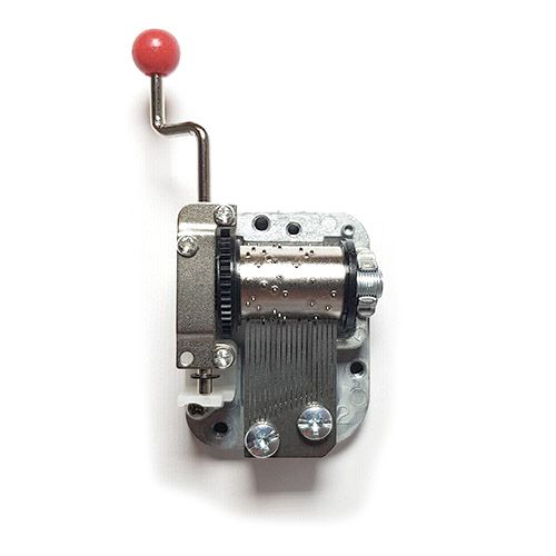 Zilverkleurig mechanisch muziekdoosje met een rood handvat.