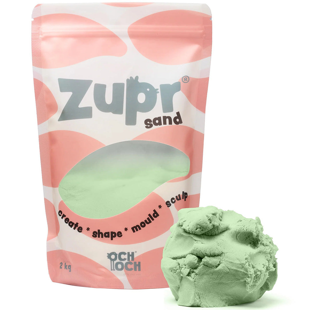 Och Och Zupr kinetisch zand in een groene verpakking met daarnaast een hoopje groen zand.