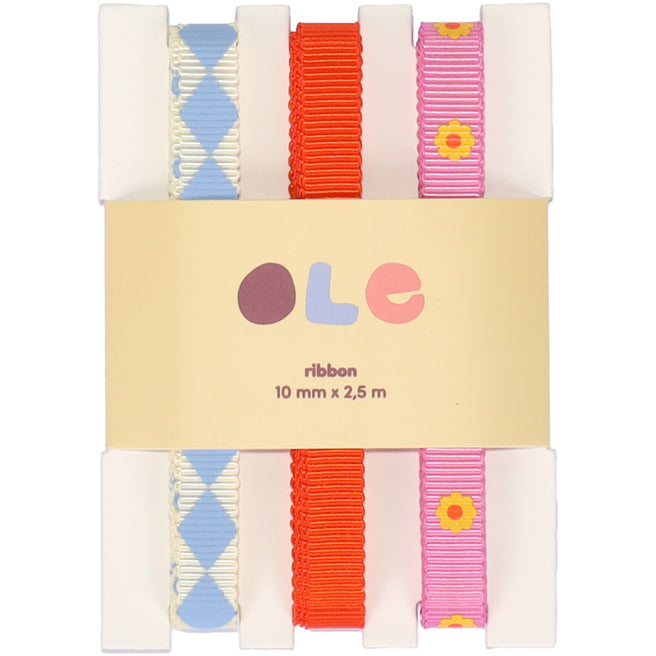 Ole cadeaulint verpakking met drie rollen lint: blauw met ruitpatroon, effen oranje en roze met bloemen.