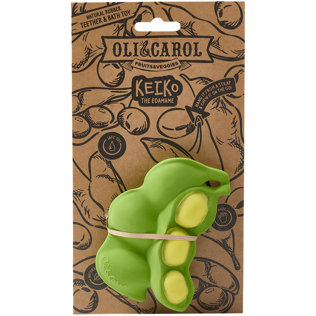 Het Oli & Carol edamame bijtspeeltje in de bruine kartonnen verpakking.