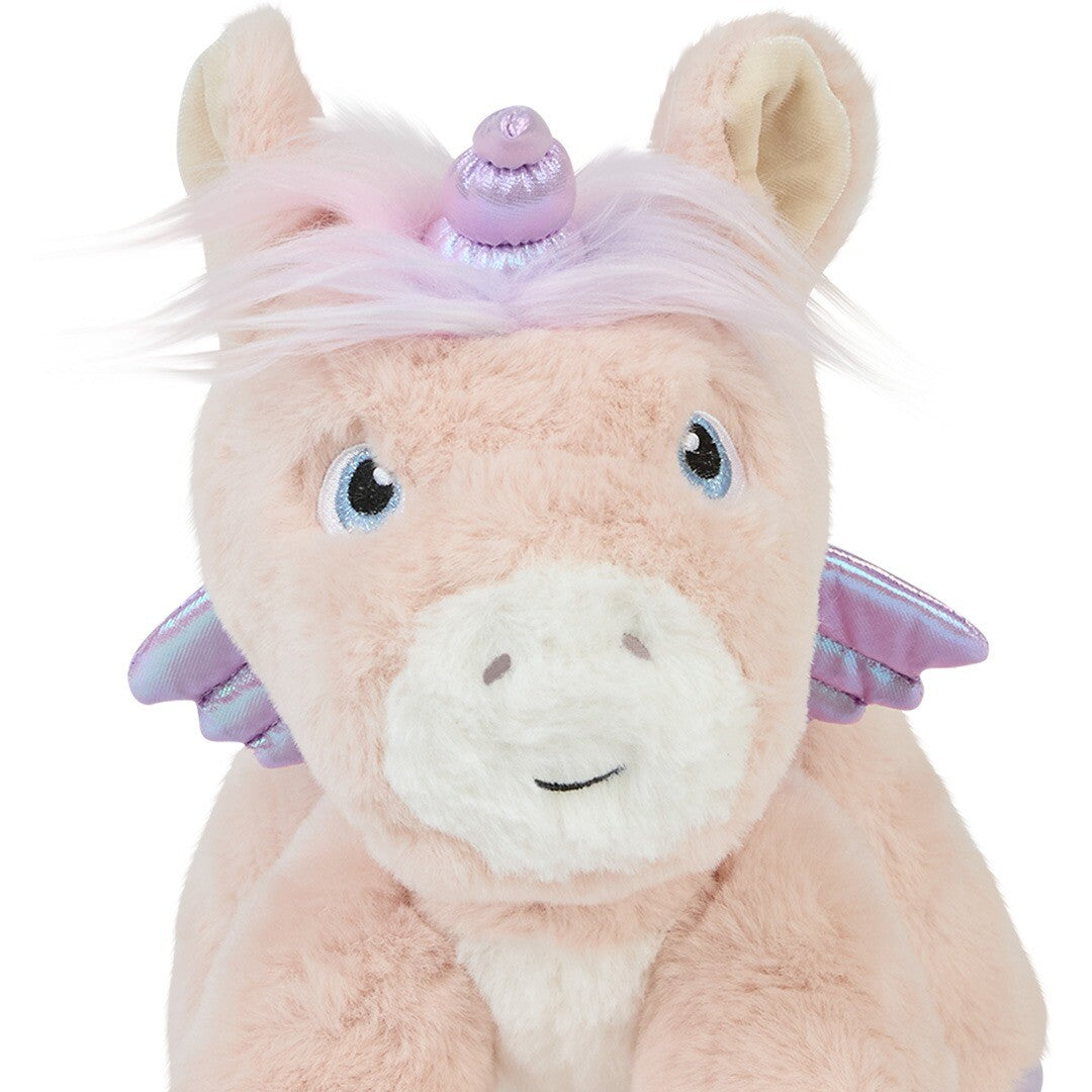 Close-up van het gezicht van de roze olli ella pluchen eenhoorn knuffel.