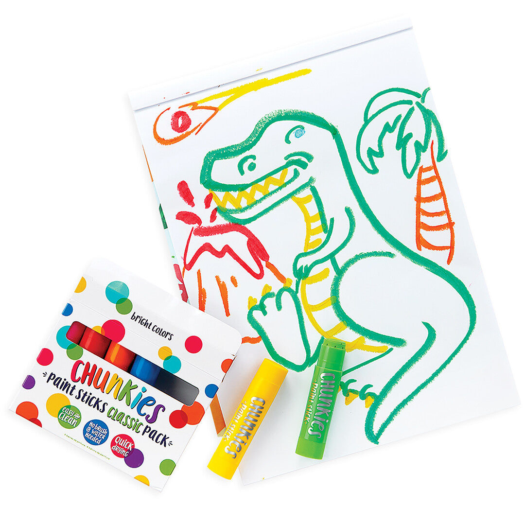 Een tekening van een dinosaurus gemaakt met ooly Chunkies verfkrijtjes, met twee krijtjes en een verpakking ernaast.