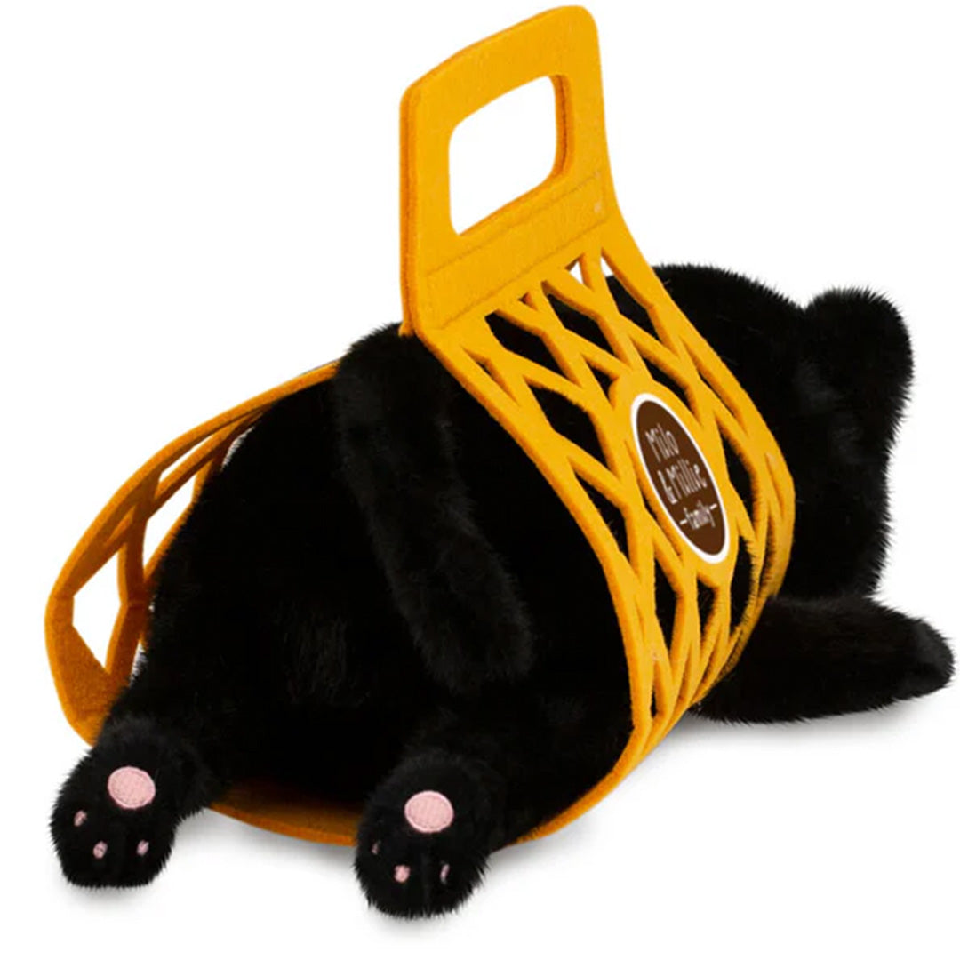Orange Toys pluchen zwarte kat Milo in een gele draagtas, van achteren gezien met roze pootjes.