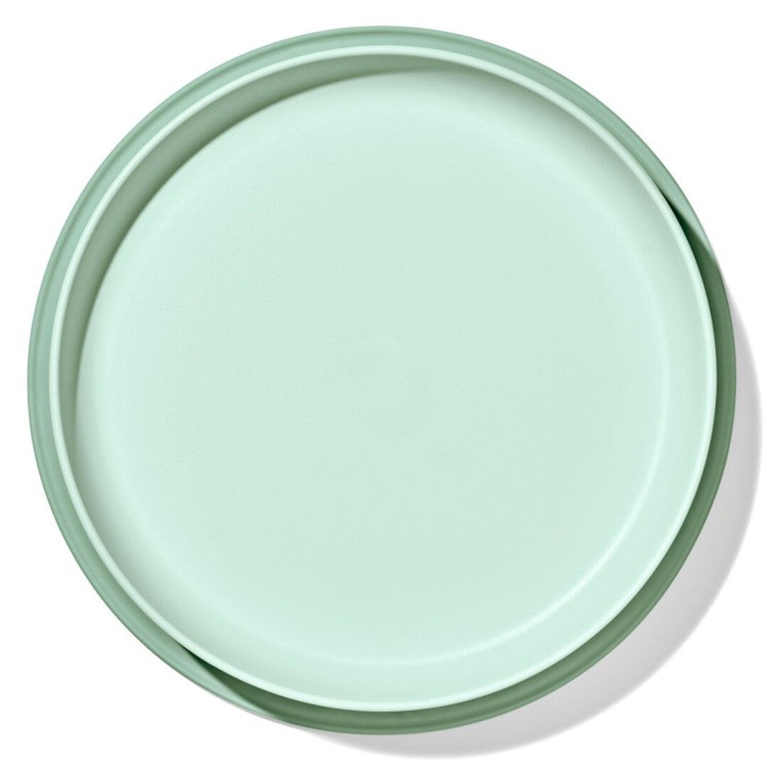Oxo Tot babybord met zuignap in lichtgroen, van bovenaf gezien.
