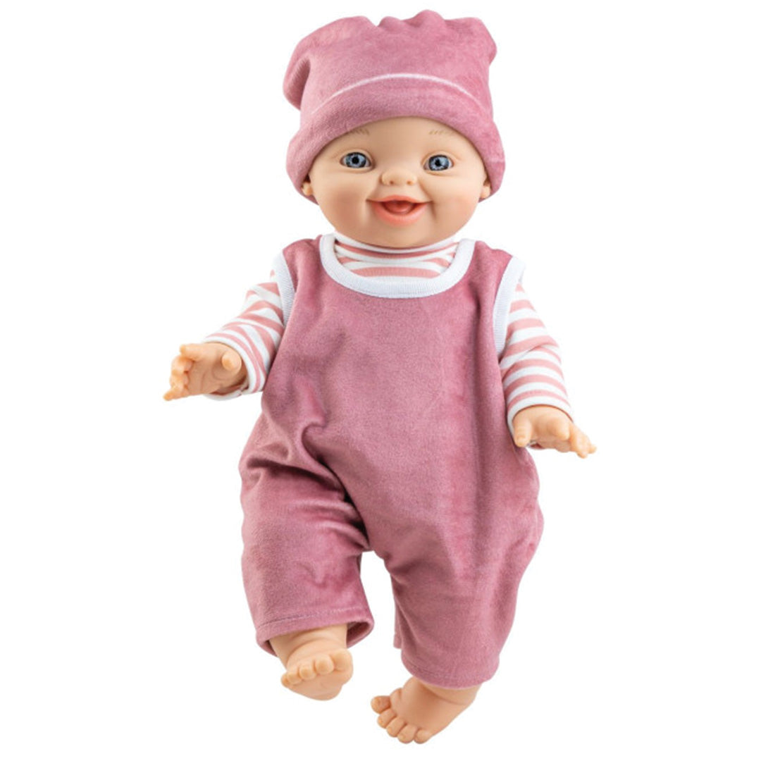 Paola Reina babypop met roze muts, gestreept shirt en roze tuinbroek, lachend.