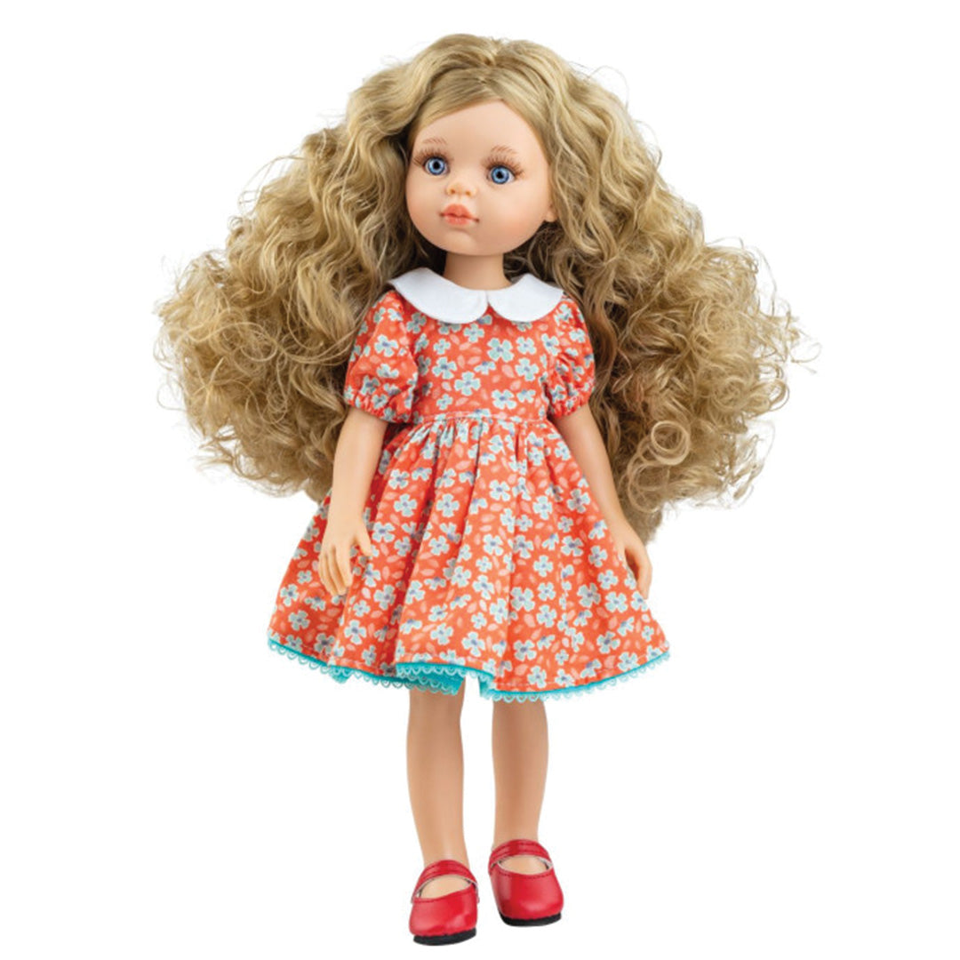 Paola Reina speelgoedpop met lang blond krullend haar, een oranje gebloemde jurk en rode schoenen.